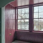 Colorful window nook with decorative trim.