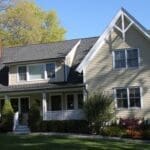 Charming two-story house with a porch.