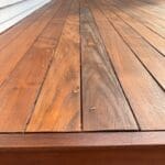 Wooden deck with natural finish.