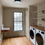 Bright farmhouse laundry room with washer, dryer