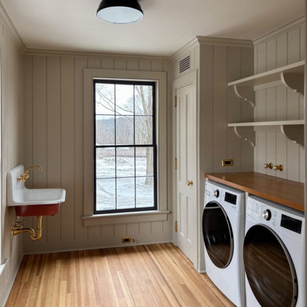 Bright farmhouse laundry room with washer, dryer
