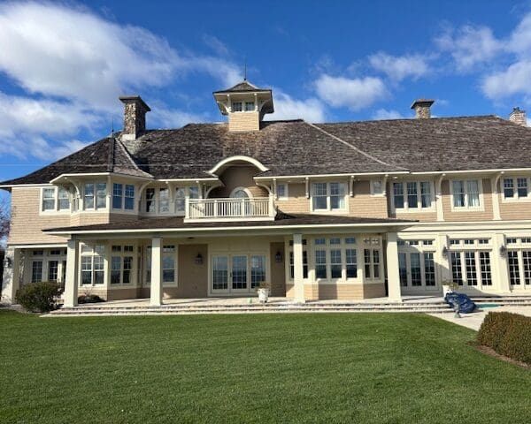 Large two-story house with porch and lawn